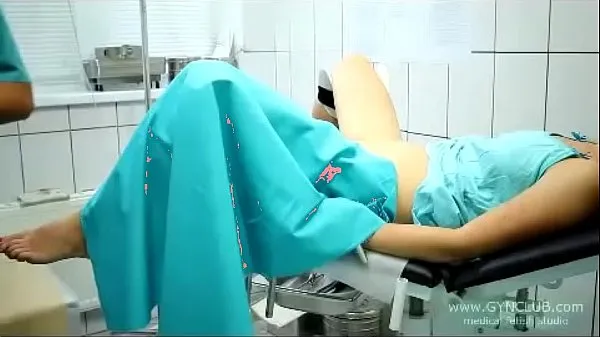 XXX beautiful girl on a gynecological chair (33 posnetki Videoposnetki